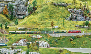 Modélisme. Un train de voyageurs Saint-Moritz - Scuol-Tarasp 3 A la Fondation Kaeserberg en Suisse, l’automotrice ABe 4/4 501 est en tête d’un train de voyageurs.